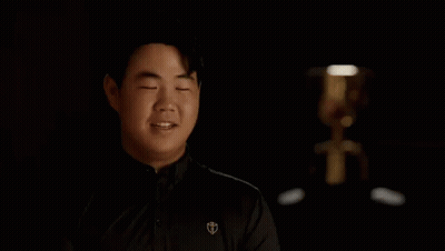 Man Covering Eyes In Dark Room GIF