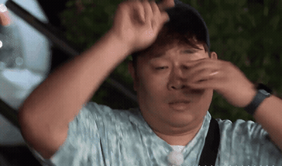 Man Covering Eyes With Hands Wearing Hat GIF