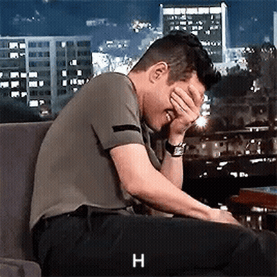 Man Covering Face In Chair GIF