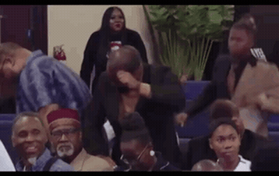 Man Covering Face In Church GIF