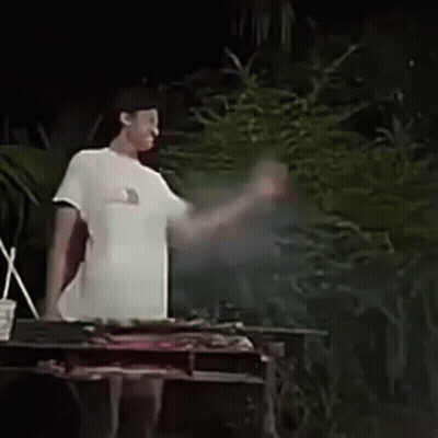 Man Covering Face In Front Of Grill GIF