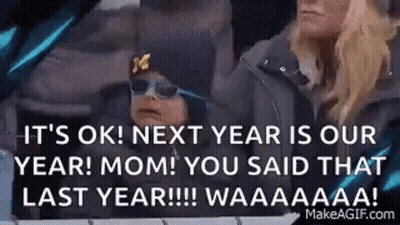 Man Covering Face In Front Of NY Giants Ad GIF