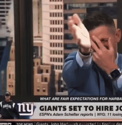Man Covering Face In Front Of NY Giants Headline GIF