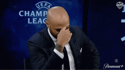 Man Covering Face In Front Of UEFA Champ Leag GIF