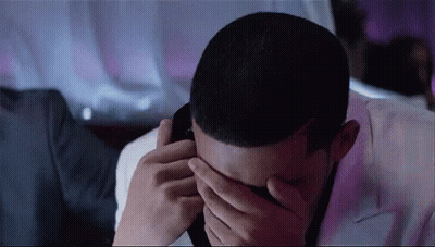 Man Covering Face Talking On Phone GIF