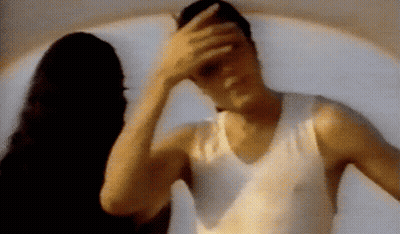 Man Covering Face While Woman Looks On GIF