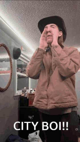Man Covering Face With Hands And Words City Boi GIF
