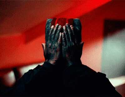Man Covering Face With Hands Red Background GIF