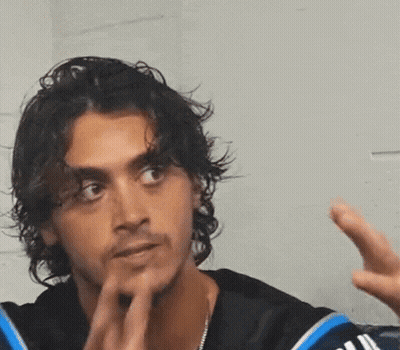 Man Covering Face With SR Jacket GIF