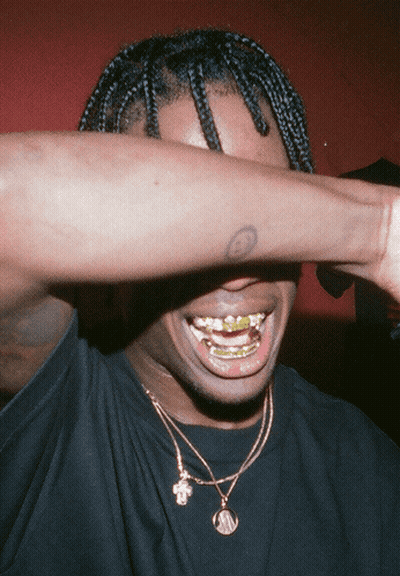 Man Covering Face With Tattooed Arm GIF