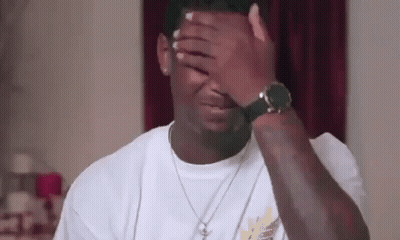 Man Covering Face With Watch And Necklace GIF