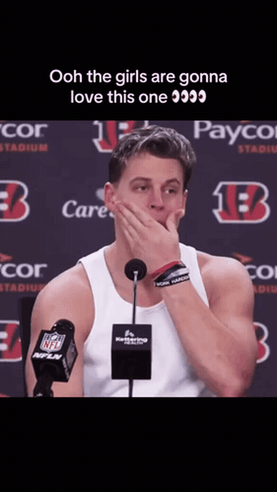 Man Covering Mouth At Microphone In Front Of Payco Sign GIF
