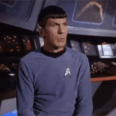 Man Covering Mouth In Front Of Orange Wall GIF
