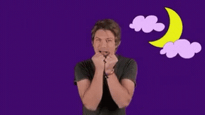 Man Covering Mouth In Front Of Purple Clouds And Moon GIF