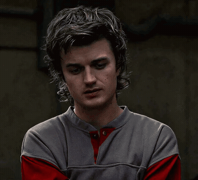 Man Covering Mouth In Gray And Red Shirt GIF