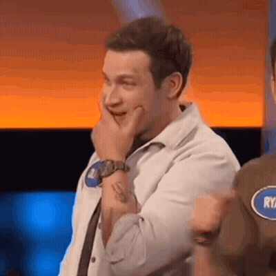 Man Covering Mouth Wearing Watch On TV Show GIF