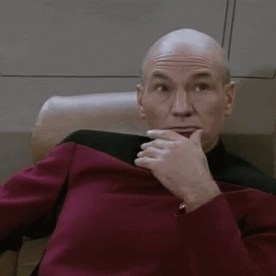 Man Covering Mouth While Sitting In Chair GIF