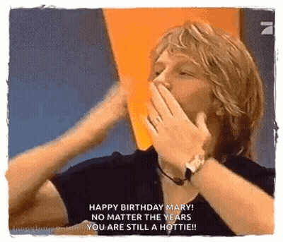 Man Covering Mouth While Woman Says Happy Birthday Mary