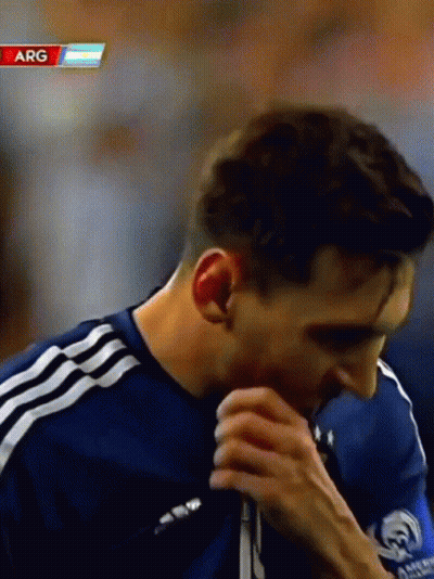 Man Covering Mouth With Hand In Arg Shirt GIF