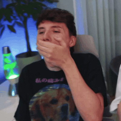Man Covering Mouth With Hand In Dog Shirt GIF