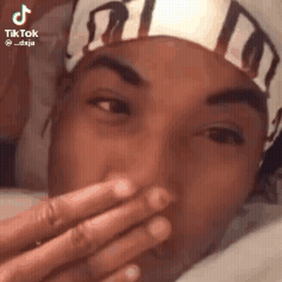 Man Covering Mouth With Headband GIF