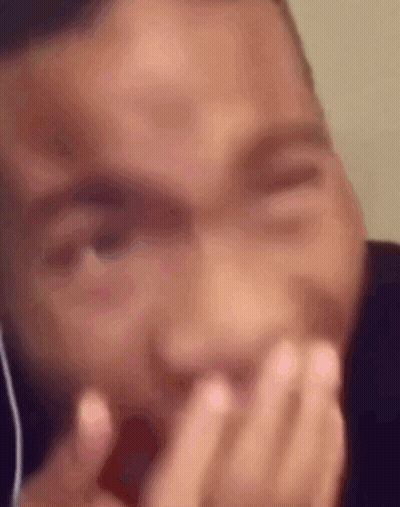Man Covering Mouth With Headphones GIF