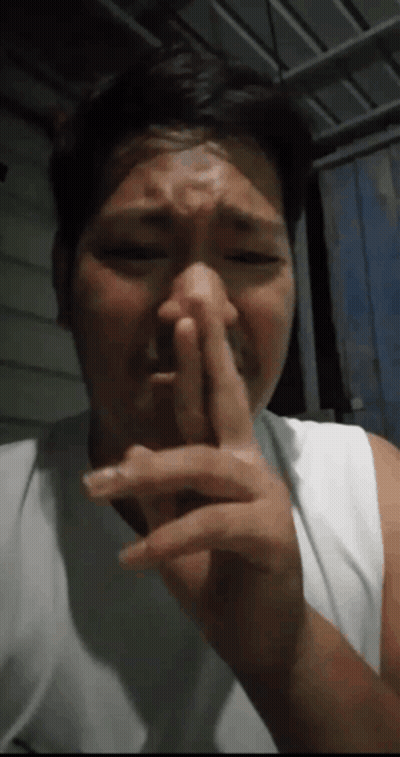 Man Covering Nose GIF