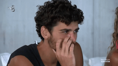 Man Covering Nose Watching Survivor GIF