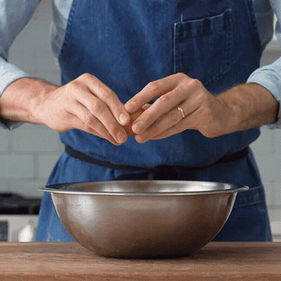 Man Cracking Egg Into Metal Bowl GIF
