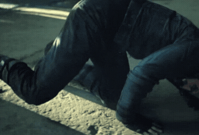 Man Crawling On Ground With Hands On Head GIF