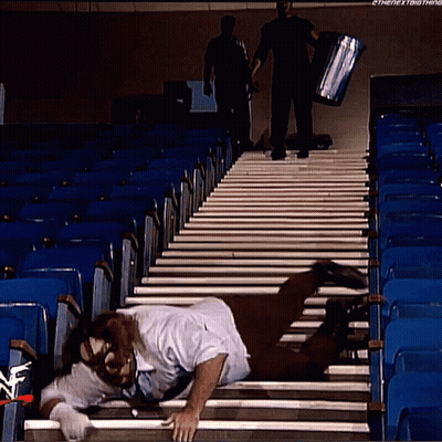 Man Crawling Stairs Watched By Man With Box GIF