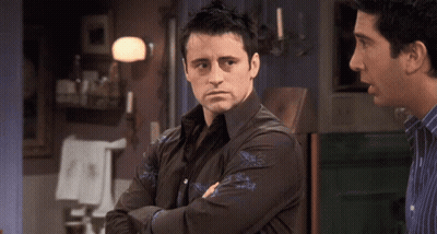 Man Crossed Arms Looking At Another GIF