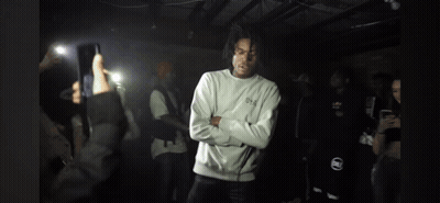 Man Crossed Arms Surrounded By People GIF