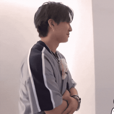 Man Crosses Arms Holding Teddy Bear GIF