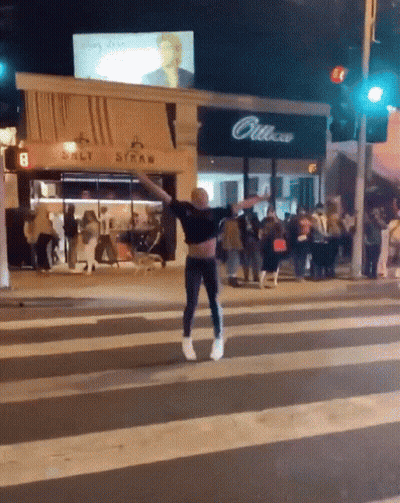 Man Crossing Street In Front Of Salt Straw Store GIF