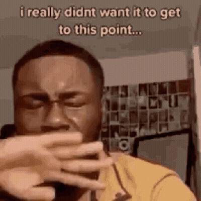 Man Crying Covering Mouth On Phone GIF