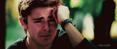 Man Crying Holding Hand To Face GIF
