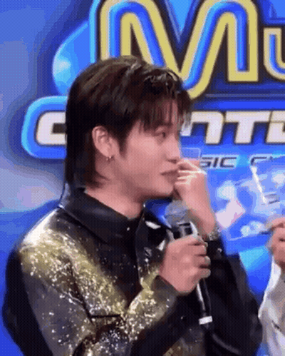 Man Crying Holding Microphone Sign M GIF