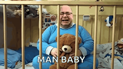 Man Crying Holding Teddy Bear In Crib Saying Man Baby GIF