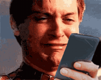 Man Crying Looking At Cellphone GIF