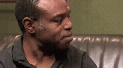 Man Crying While Sitting On Couch GIF