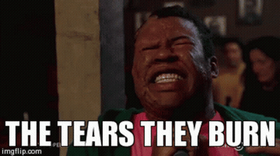 Man Crying With The Tears They Burn Behind Him GIF