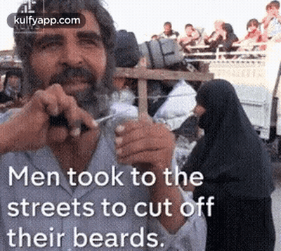 Man Cutting Off Beard With Scissors GIF