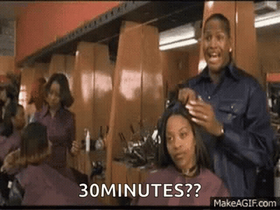 Man Cutting Woman's Hair Says 30 Minutes GIF