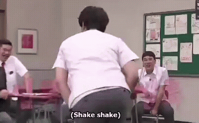 Man Dancing In Classroom While Men Sit At Desks GIF