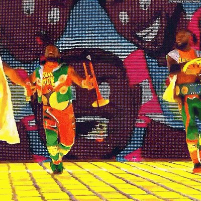 Man Dancing In Colorful Outfit Holding Trumpet GIF
