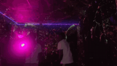 Man Dancing In Dark Room With Purple Lights GIF