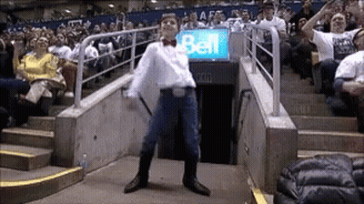 Man Dancing In Front Of Bell Sign GIF