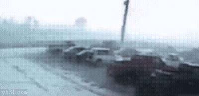 Man Dancing In Front Of Car In Foggy Street GIF