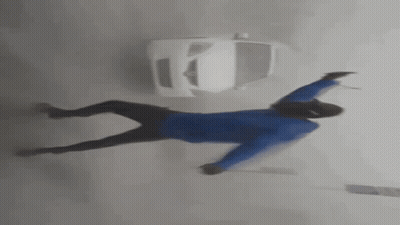 Man Dancing In Front Of Car In Foggy Street GIF